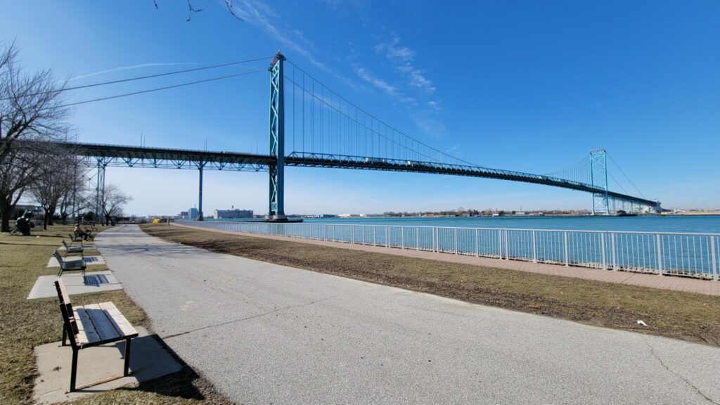 This is a picture of a bicycle path leading up to the Ambassador Bridge in Windsor. The sky is a very bright blue